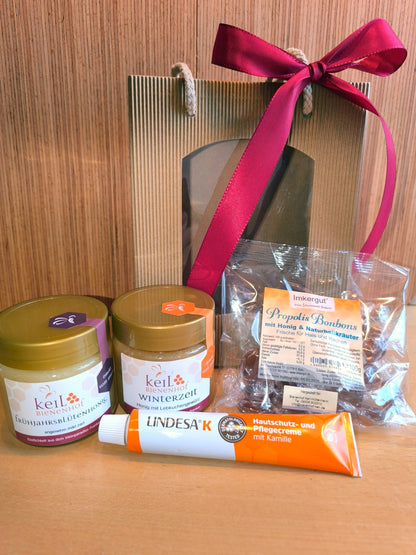 BBV Geschenkpaket 1 vom Bienenhof Keil: Frühjahrsblütenhonig, Winterzeit, Propolis-Bonbons und Lindesa K in der Geschenktüte