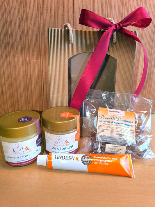 BBV Geschenkpaket 1 vom Bienenhof Keil: Frühjahrsblütenhonig, Winterzeit, Propolis-Bonbons und Lindesa K in der Geschenktüte